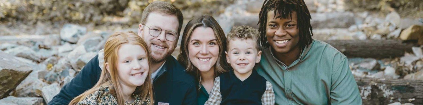 Christina Taylor with her husband and three children outdoors